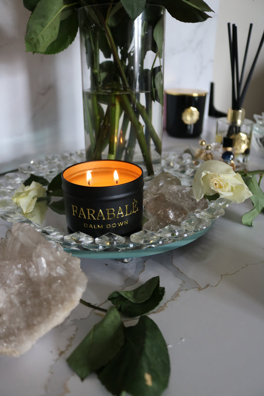 Black candle  metal tin with  gold metal label and logo. Organic wick with non toxic, phthalate free fragrance oils and soy and coconut apricot wax.